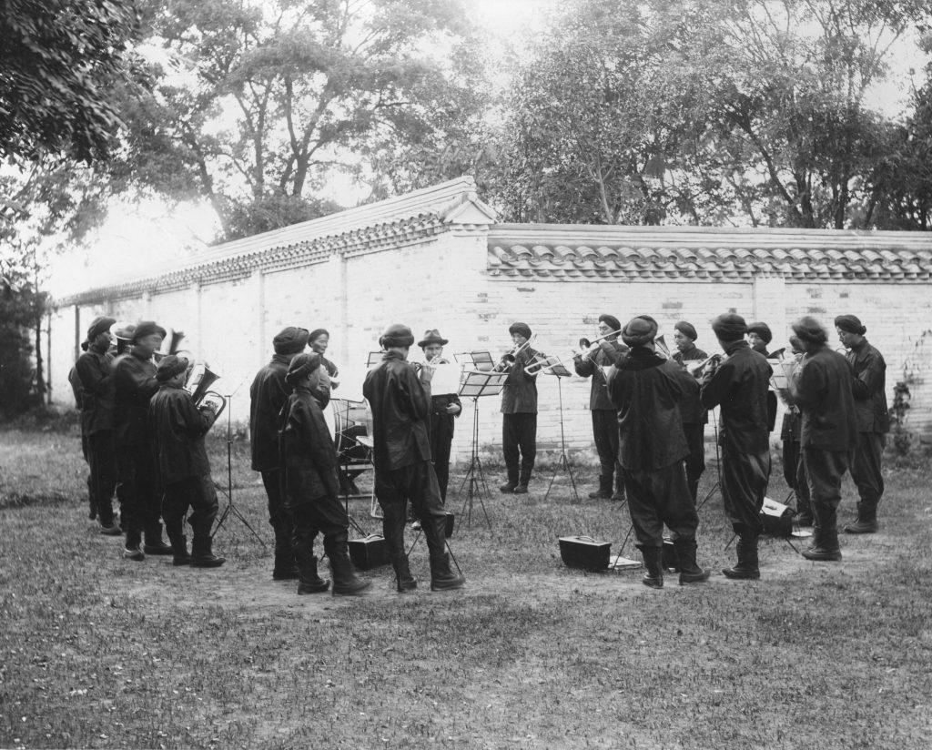 Hart's personal brass band playing in the garden of his house in Beijing, c. 1903. MS 15/6/9/2a.